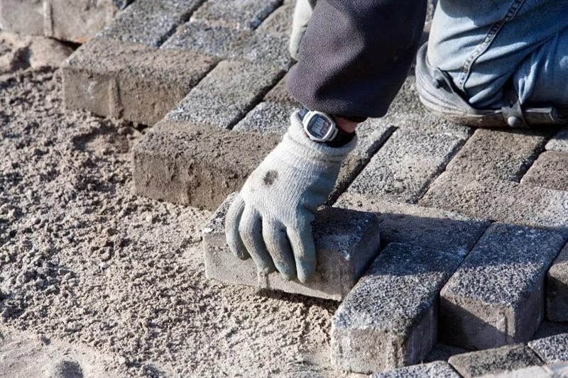 Person Laying Brick