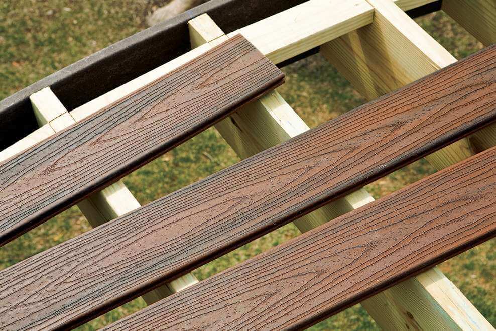 Best Deck Material Options For 2024 Decks Com   Trex Decking Transcend Spiced Rum Install Cut Boards 