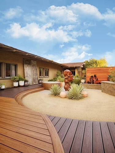 Rounded Deck With Sand And Stone Sculpture In The Center