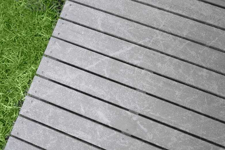 Close up of scuffed and scratched surface of a patio